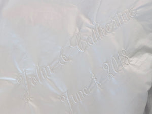 Embroidery on duvet with names and wedding date
